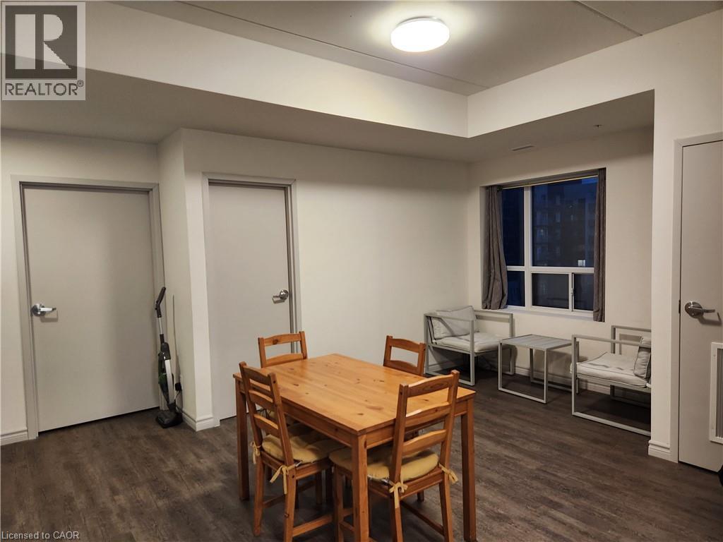 Dining room with dark wood-type flooring - 269 Sunview Street Unit# 607, Waterloo, ON - Indoor Photo Showing Dining Room