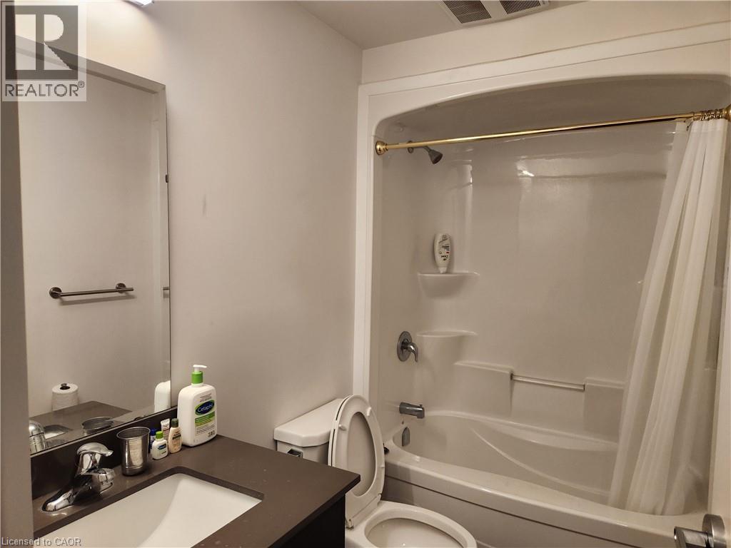 Full bathroom featuring toilet, shower / tub combo, visible vents, and vanity - 269 Sunview Street Unit# 607, Waterloo, ON - Indoor Photo Showing Bathroom