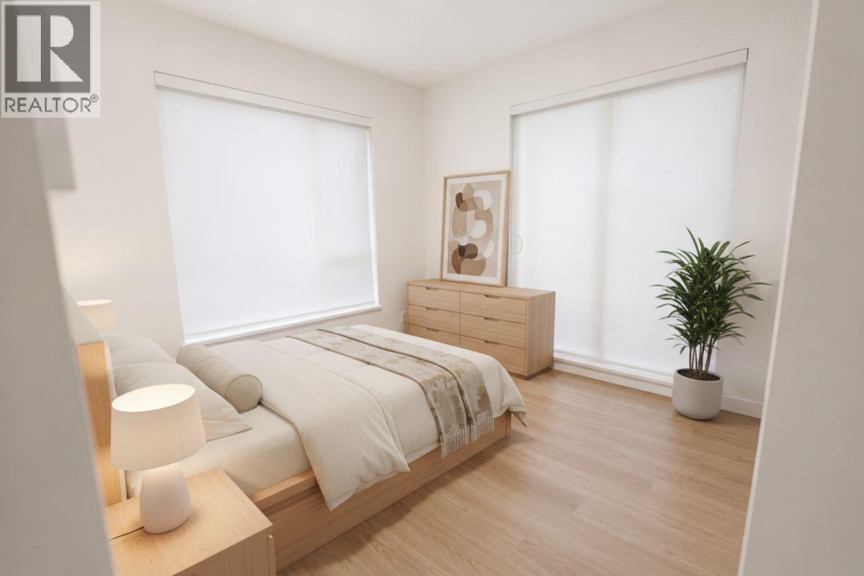 Bedroom with balcony - 1380 Pridham Avenue Unit# 409, Kelowna, BC - Indoor Photo Showing Other Room