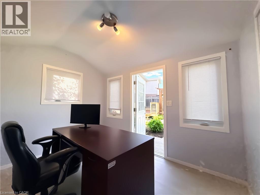 Bright interior space featuring light gray walls and a vaulted ceiling - 33 Remple Court, Cambridge, ON - Indoor Photo Showing Office