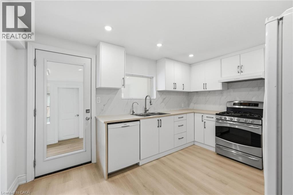 1062 Cannon Street E, Hamilton, ON - Indoor Photo Showing Kitchen With Double Sink