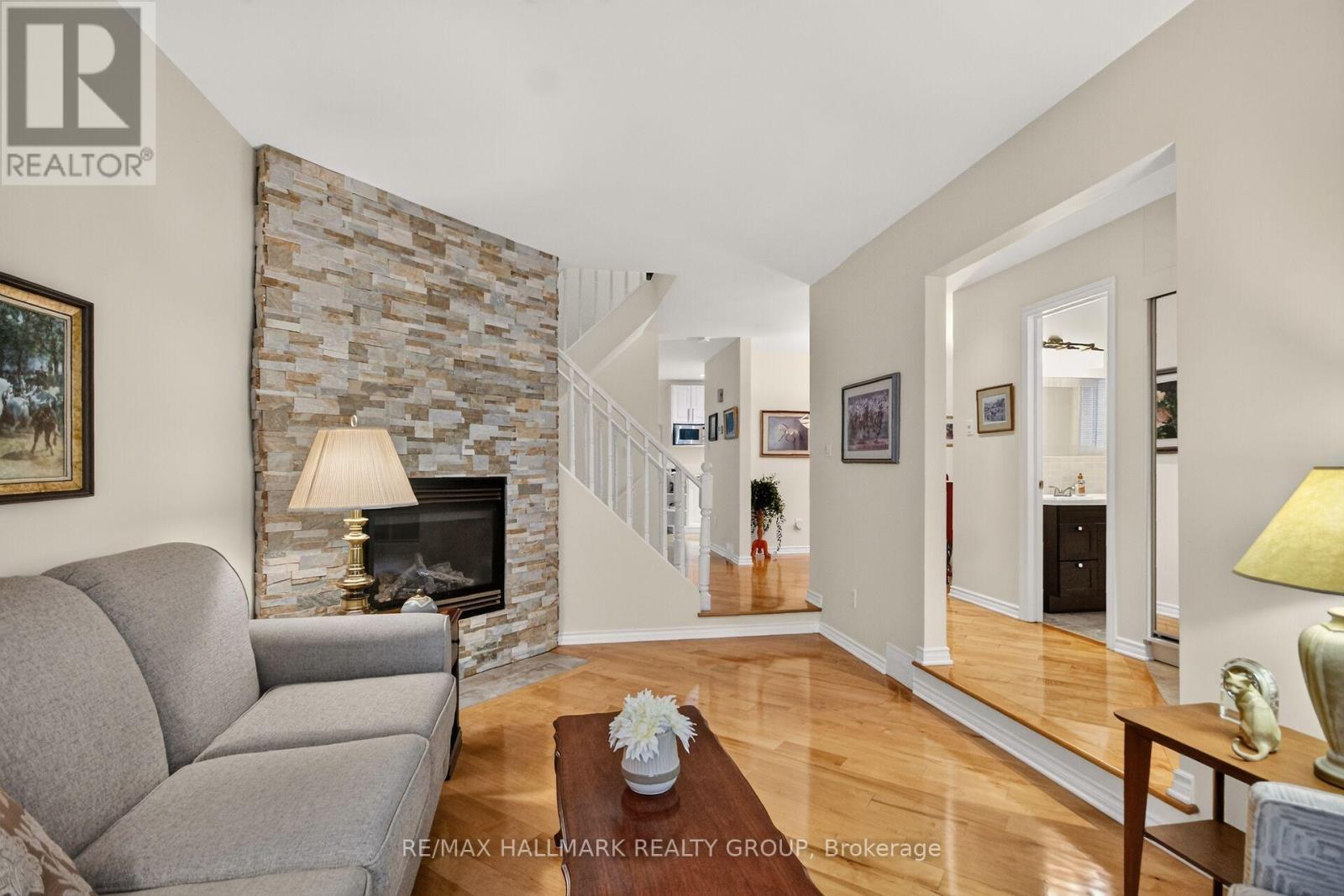 gorgeous hardwood floors throughout - 12 Ready Way, Ottawa, ON - Indoor Photo Showing Living Room With Fireplace