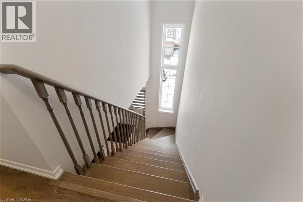 Stairway with wood finished floors - 13 Steven Drive, Thorold, ON - Indoor Photo Showing Other Room