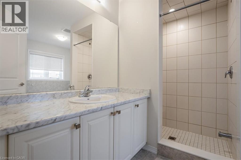 Full bath featuring visible vents, a tile shower, and vanity - 13 Steven Drive, Thorold, ON - Indoor Photo Showing Bathroom