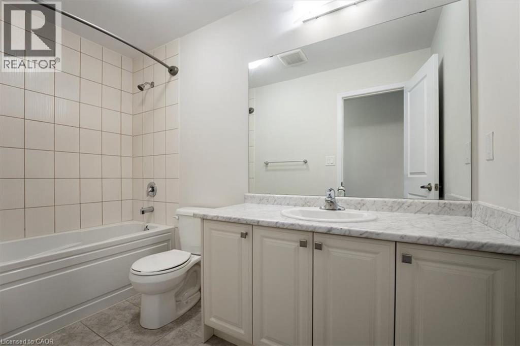 Full bath featuring visible vents, toilet, tile patterned floors, tub / shower combination, and vanity - 13 Steven Drive, Thorold, ON - Indoor Photo Showing Bathroom