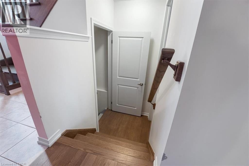 Stairs with baseboards and tile patterned floors - 13 Steven Drive, Thorold, ON - Indoor Photo Showing Other Room