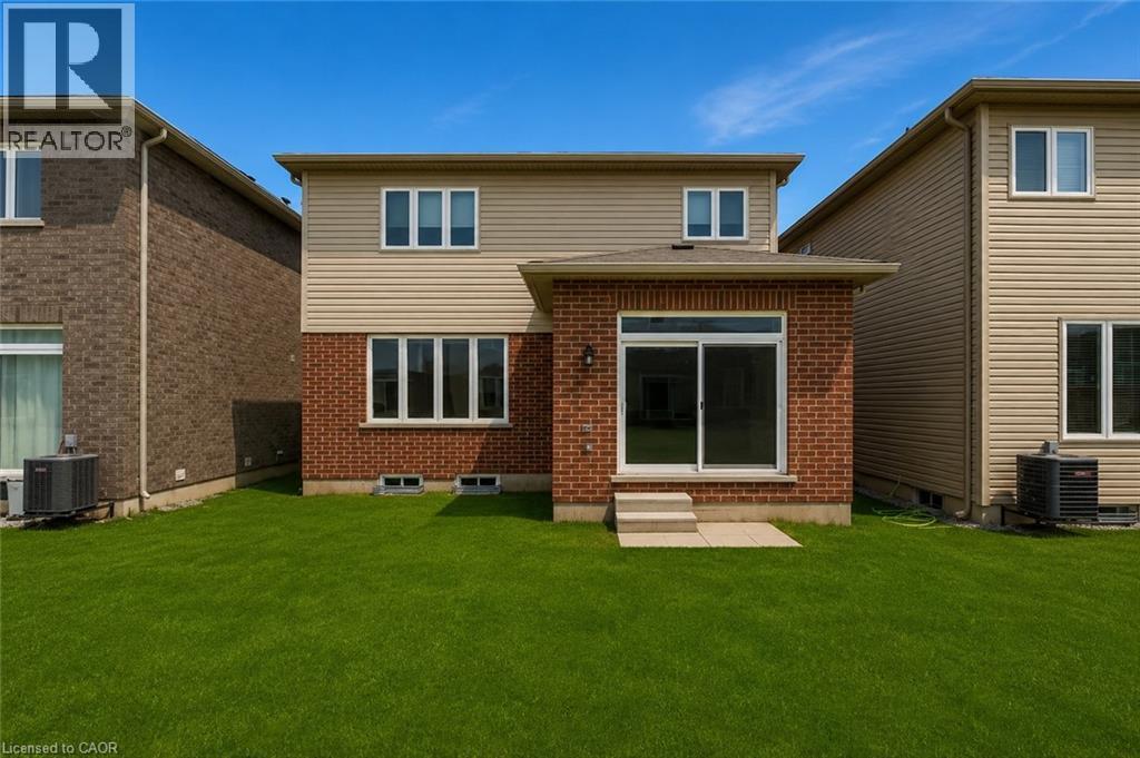 Rear exterior featuring a brick and siding facade - 13 Steven Drive, Thorold, ON - Outdoor With Exterior