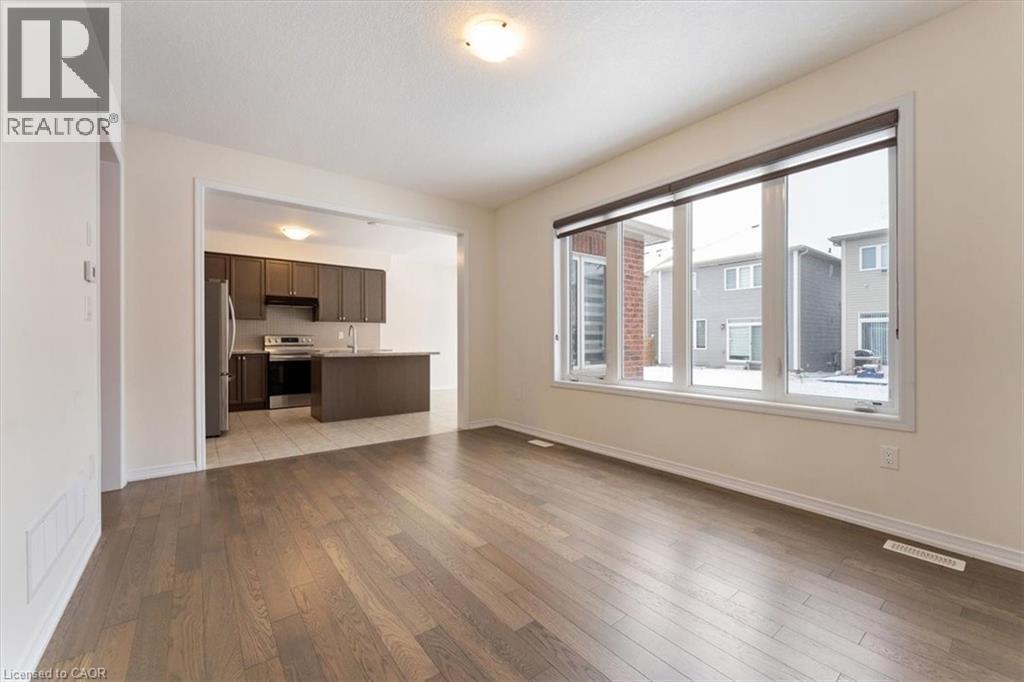 Unfurnished living room featuring wood finished floors, visible vents, and baseboards - 13 Steven Drive, Thorold, ON - Indoor Photo Showing Other Room
