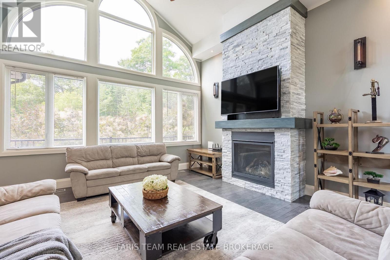 7 Duquette Court, Tiny, ON - Indoor Photo Showing Living Room With Fireplace