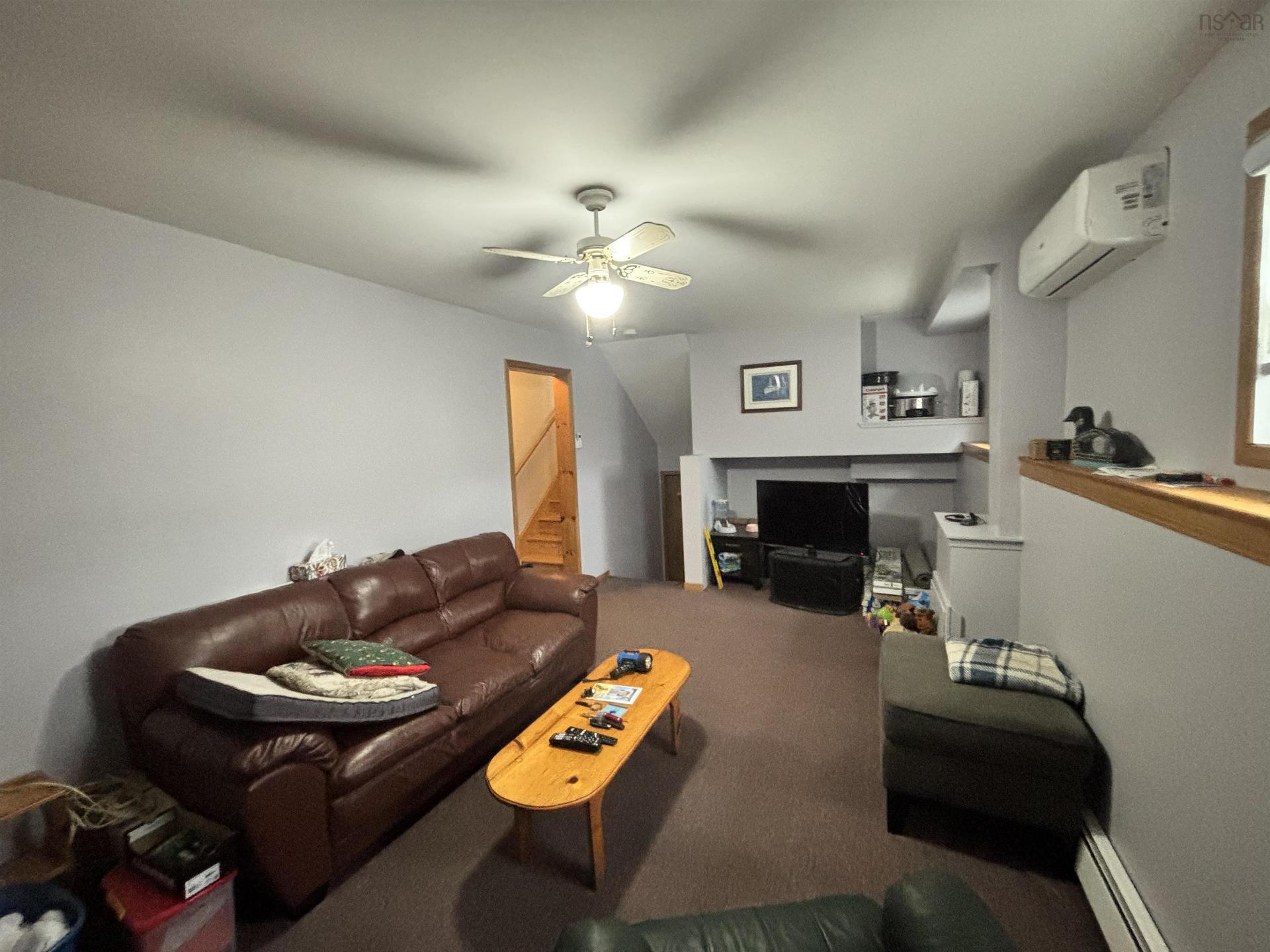 121 Pipers Lane, Inverside, NS - Indoor Photo Showing Other Room With Fireplace