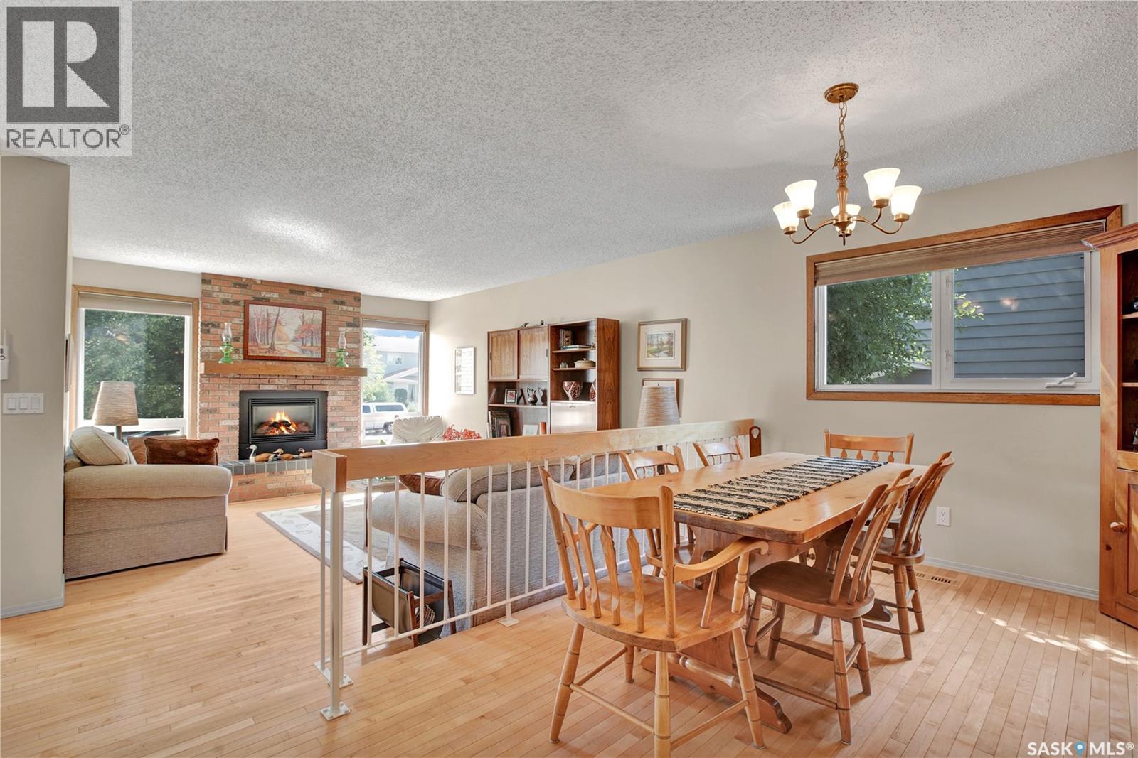 246 Perreault Crescent, Saskatoon, SK - Indoor Photo Showing Dining Room With Fireplace