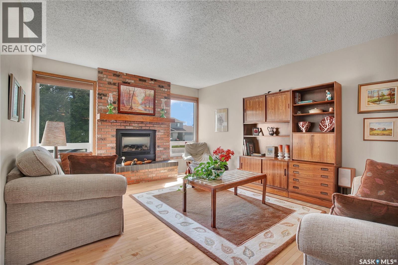 246 Perreault Crescent, Saskatoon, SK - Indoor Photo Showing Living Room With Fireplace