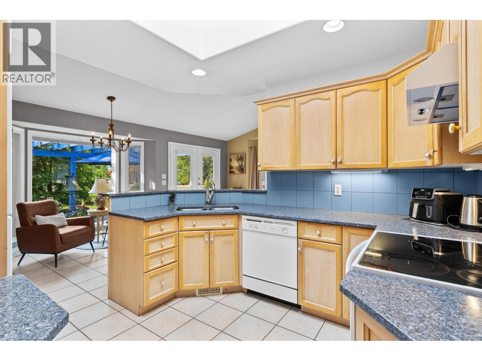 Bright skylight in kitchen. - 4000 Gallaghers Terrace, Kelowna, BC - Indoor Photo Showing Kitchen With Double Sink