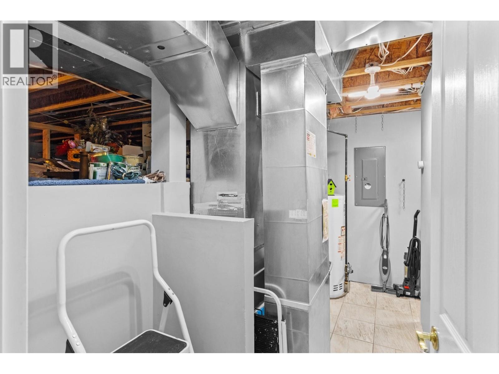 Downstairs utility room and expansive crawl storage space. - 4000 Gallaghers Terrace, Kelowna, BC - Indoor