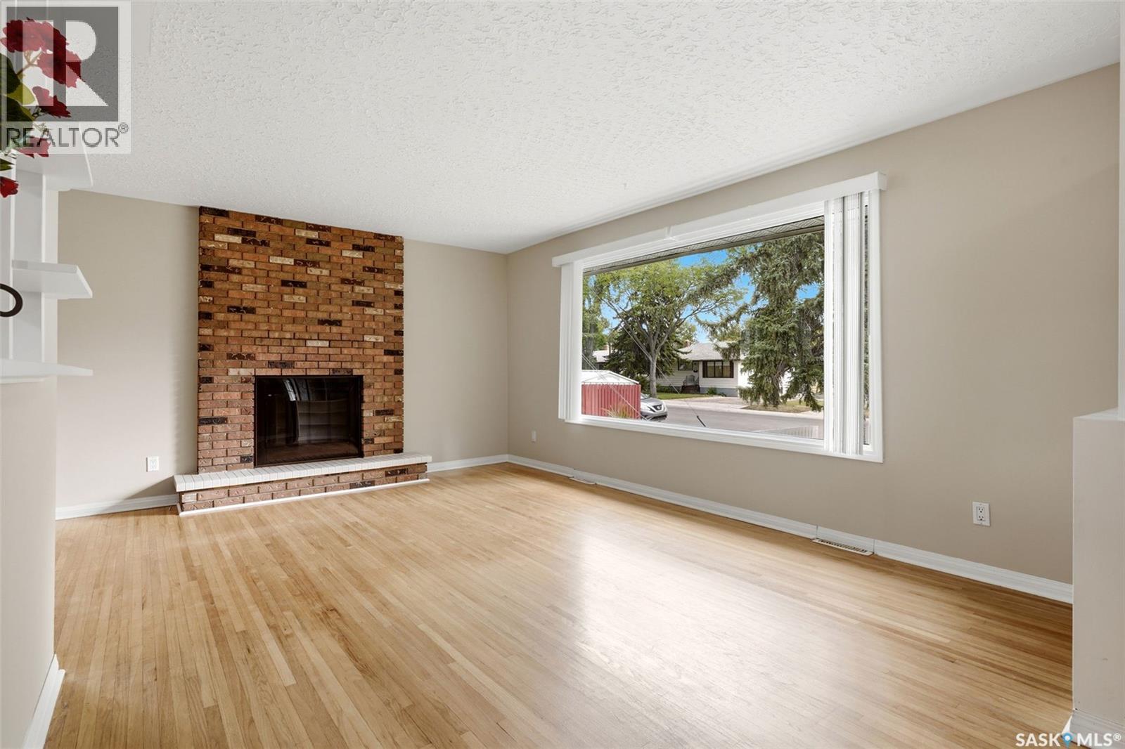 202 Mccannel Street, Regina, SK - Indoor Photo Showing Living Room With Fireplace