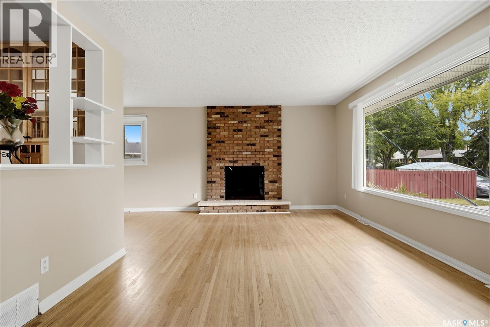 202 Mccannel Street, Regina, SK - Indoor Photo Showing Living Room With Fireplace