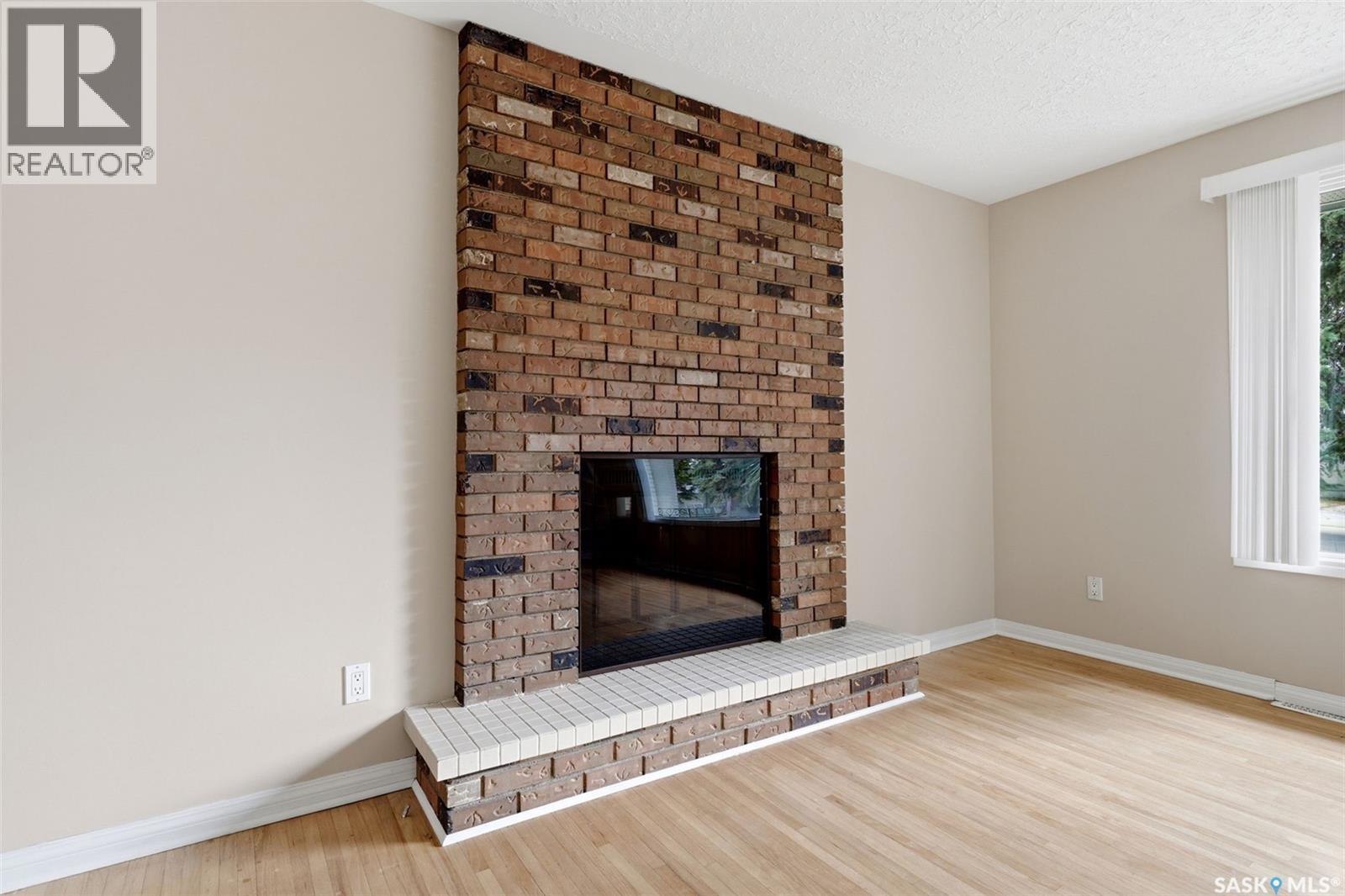 202 Mccannel Street, Regina, SK - Indoor Photo Showing Living Room With Fireplace