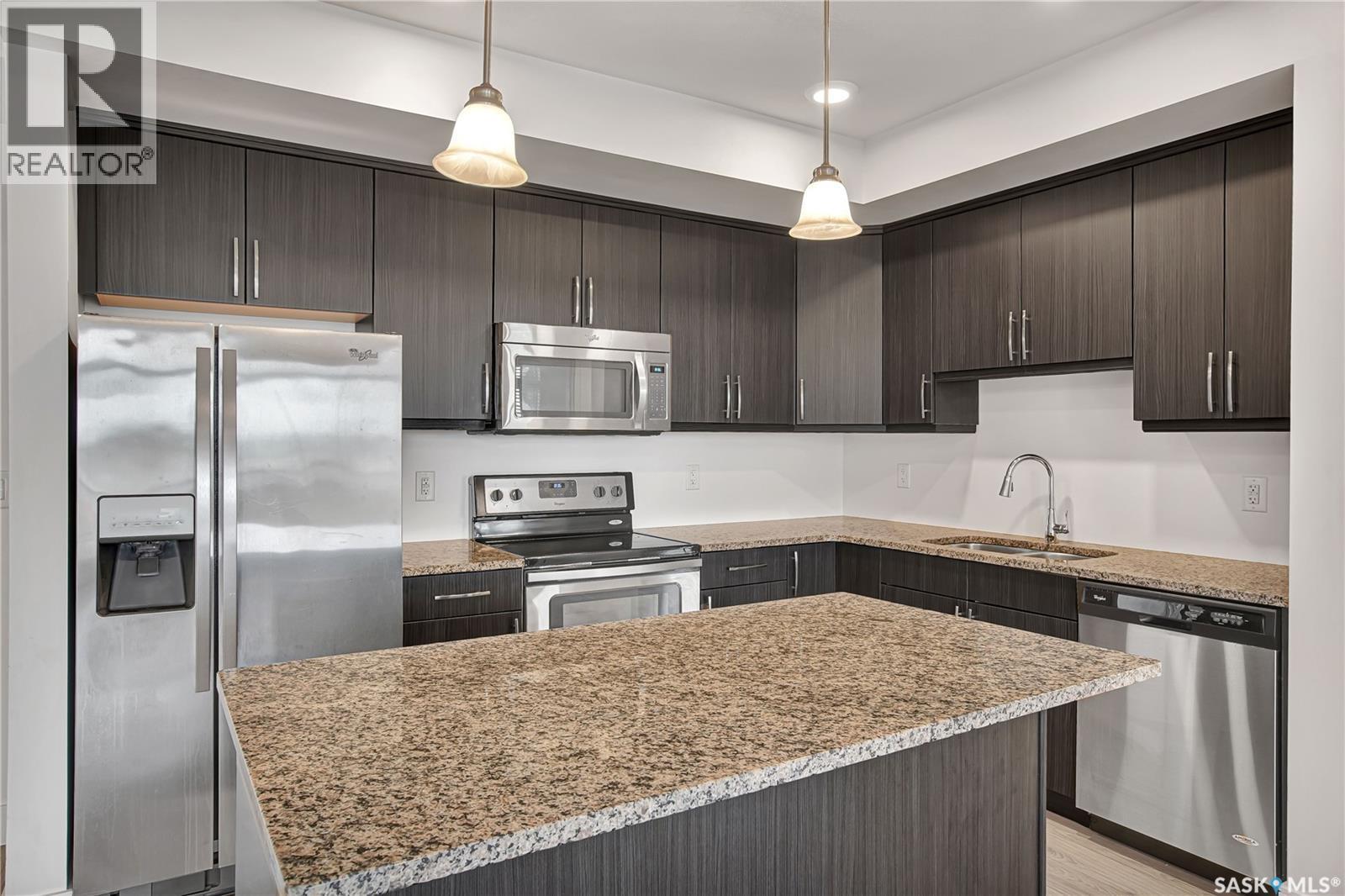 308 770 Childers Crescent, Saskatoon, SK - Indoor Photo Showing Kitchen With Stainless Steel Kitchen With Upgraded Kitchen