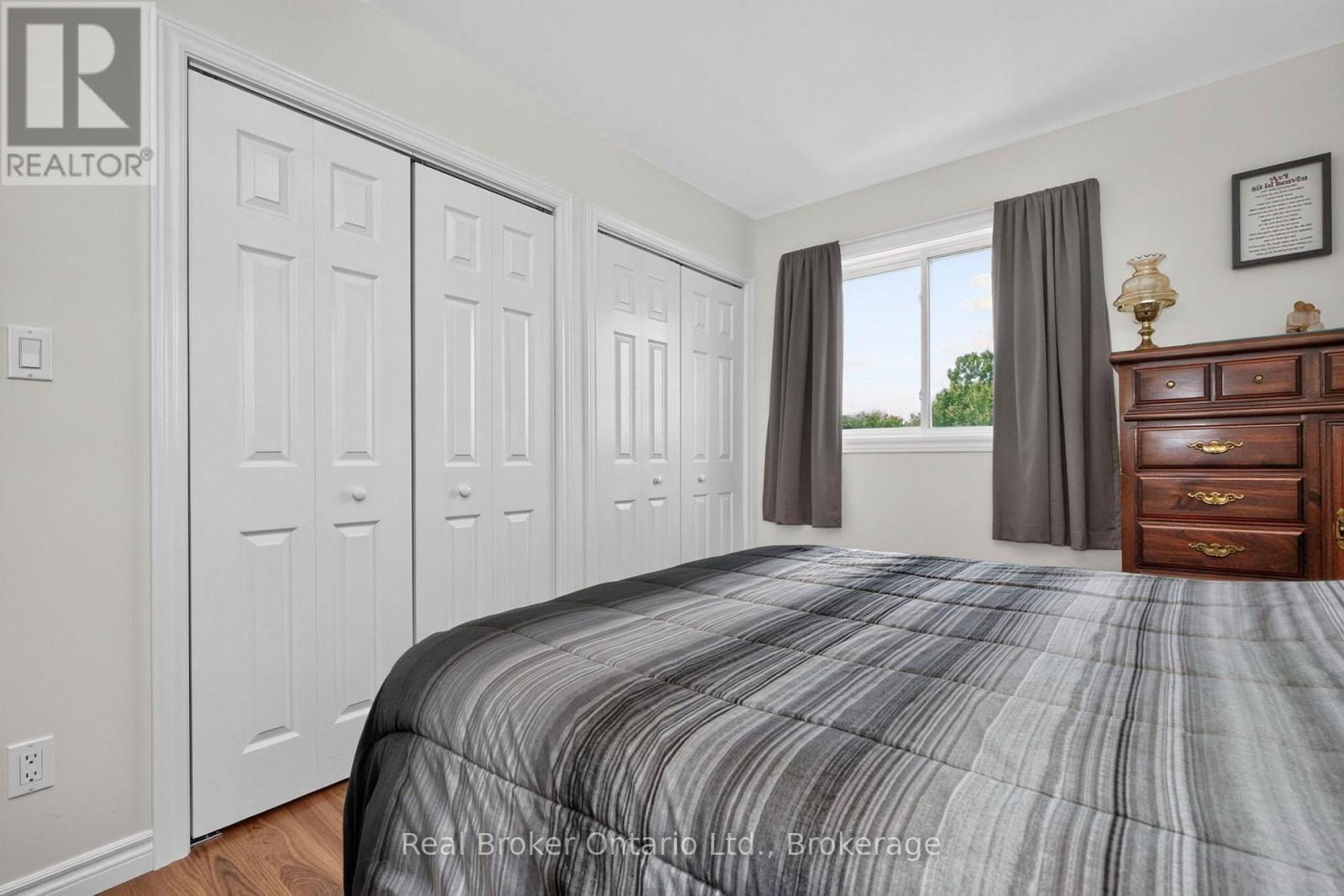 Primary Bedroom with Double Closets - 150 Lafontaine Road E, Tiny, ON - Indoor Photo Showing Bedroom