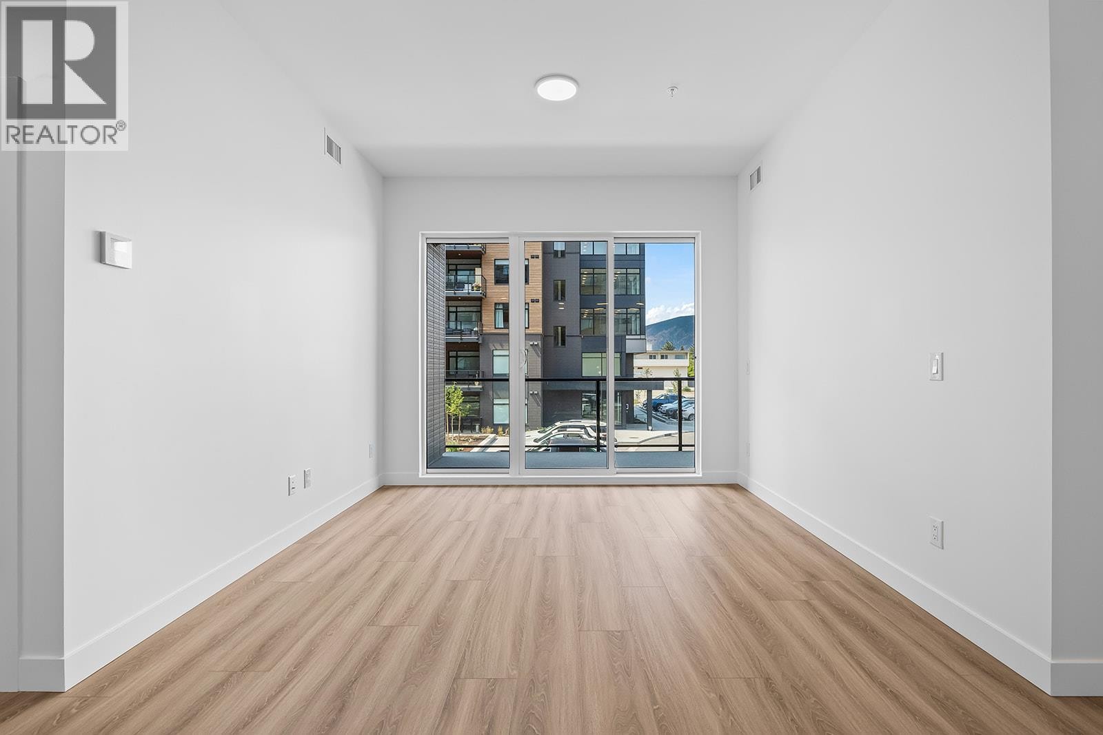 Living Room with Patio Access - 2780 Olalla Road Unit# 201, West Kelowna, BC - Indoor Photo Showing Other Room