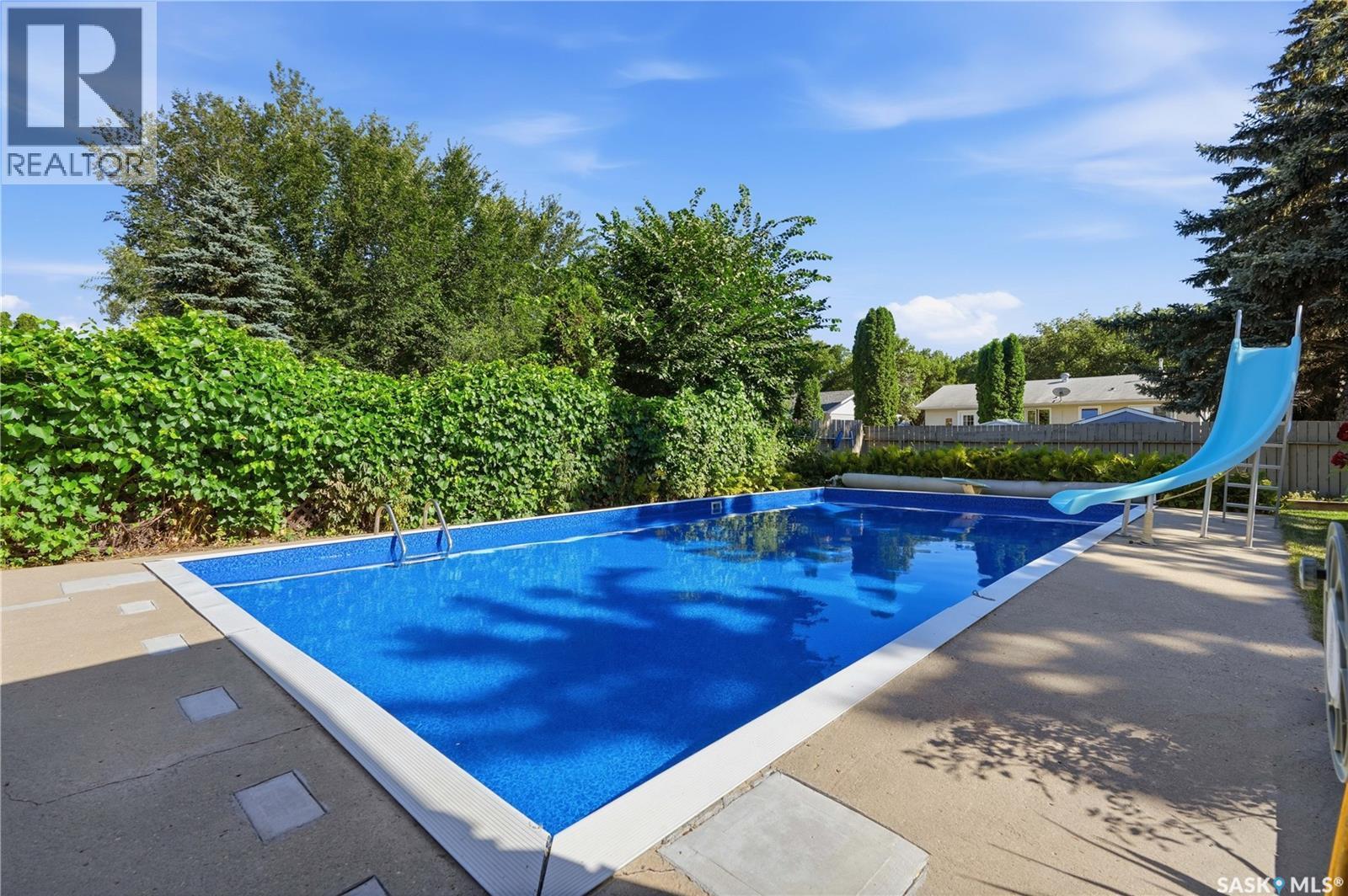 29 Everett Crescent, Regina, SK - Outdoor With In Ground Pool With Backyard