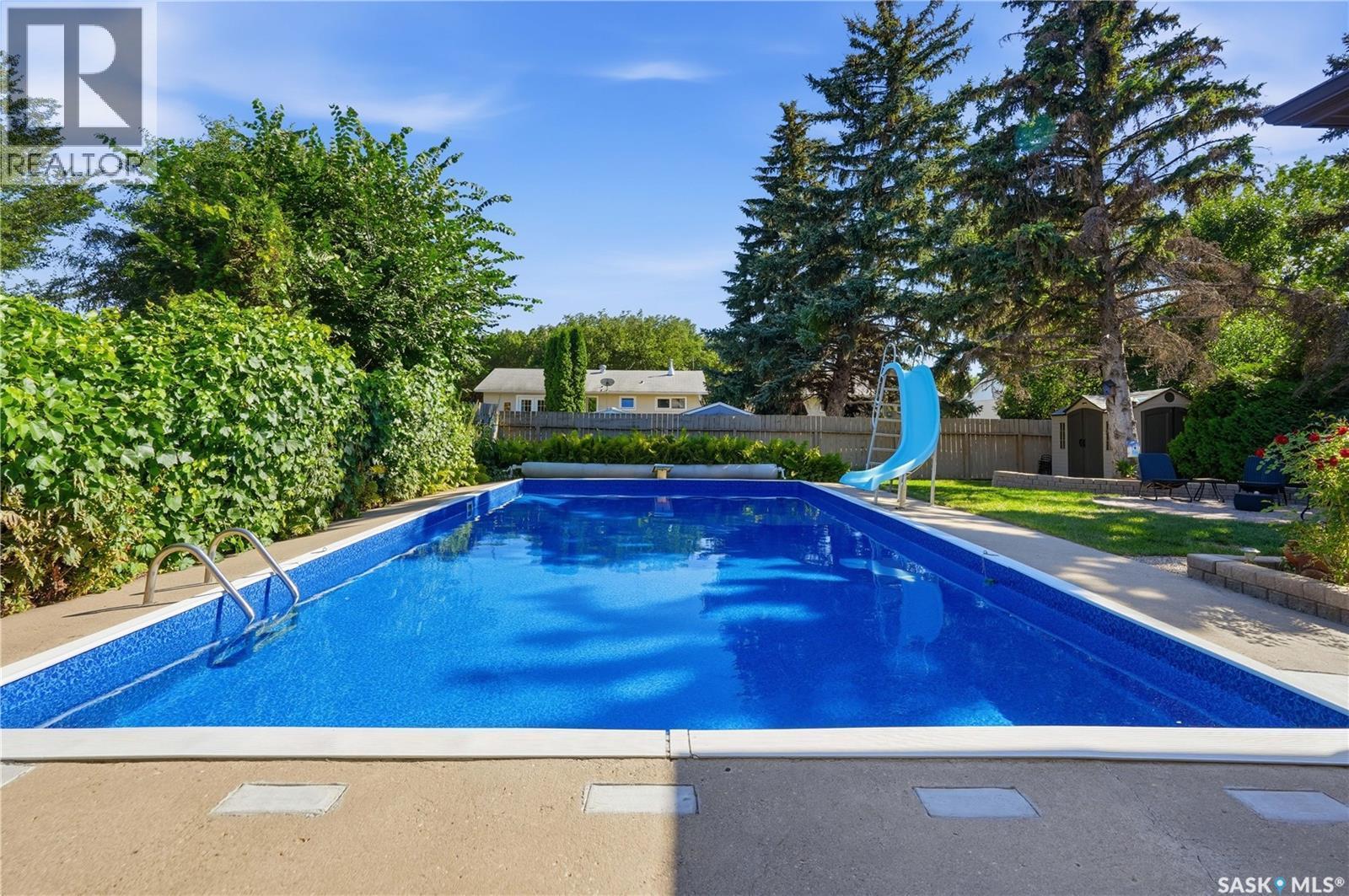 29 Everett Crescent, Regina, SK - Outdoor With In Ground Pool With Backyard