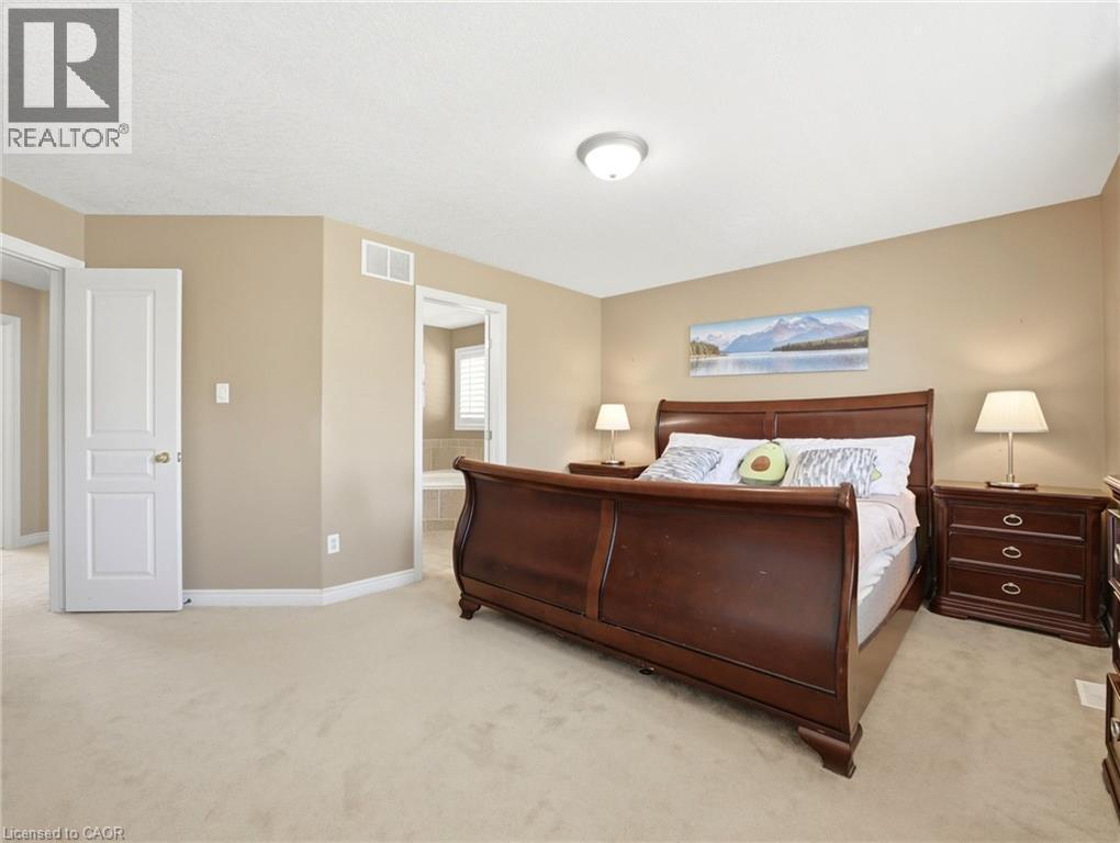 Carpeted bedroom with neutral wall tones and a white ceiling - 98 Willow Lane, Grimsby, ON - Indoor Photo Showing Bedroom