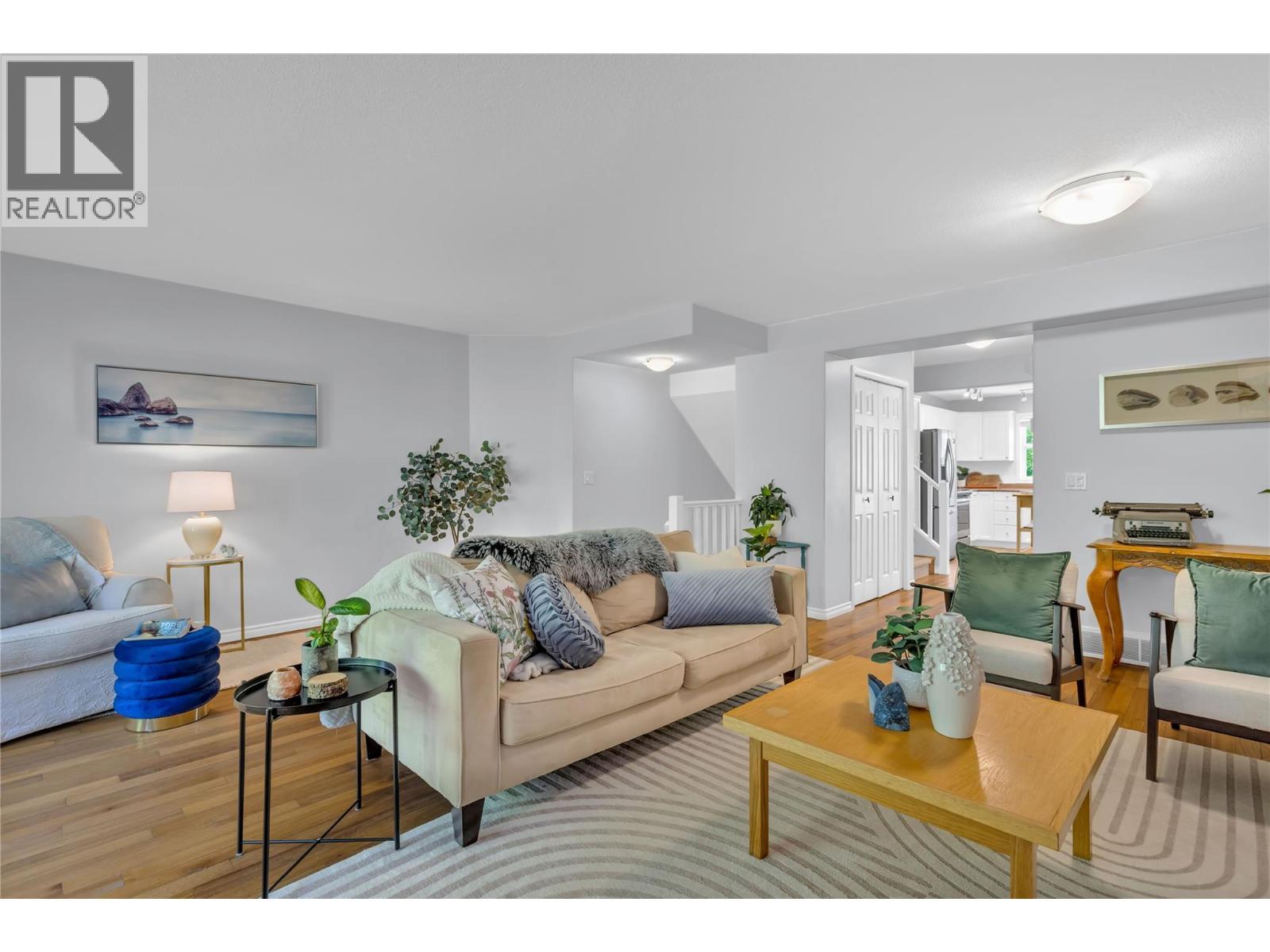 Gorgeous solid wood flooring on the main level - 3825 Glen Canyon Drive Unit# 104, West Kelowna, BC - Indoor Photo Showing Living Room