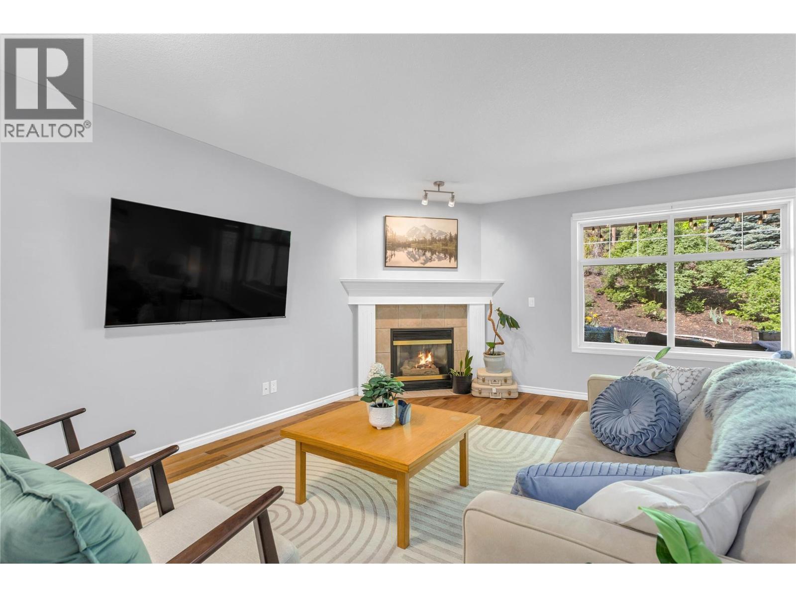 Main living area - 3825 Glen Canyon Drive Unit# 104, West Kelowna, BC - Indoor Photo Showing Living Room With Fireplace