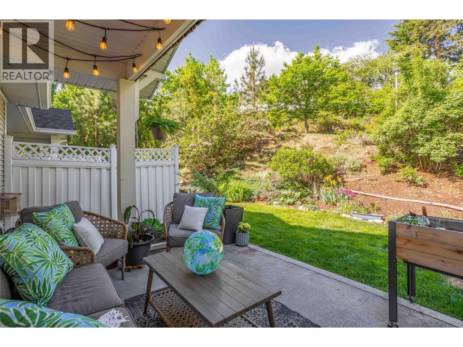 Huge back patio area looking onto green space. - 3825 Glen Canyon Drive Unit# 104, West Kelowna, BC - Outdoor With Deck Patio Veranda
