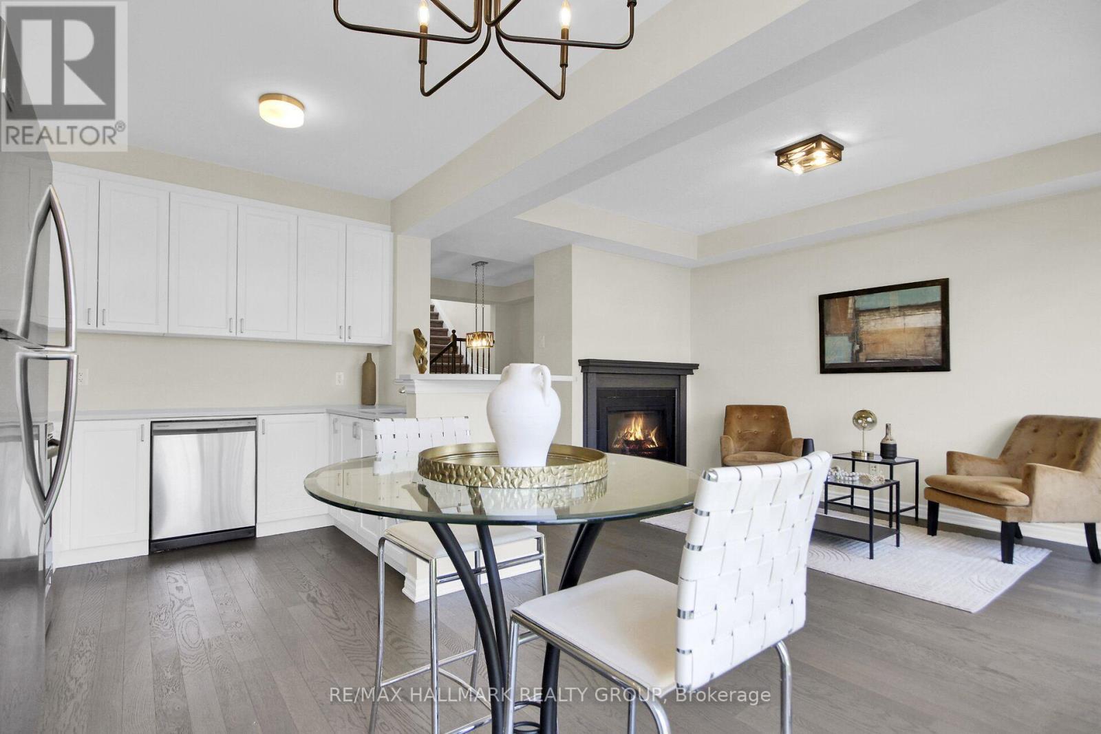 207 Willow Aster Circle, Ottawa, ON - Indoor Photo Showing Dining Room With Fireplace