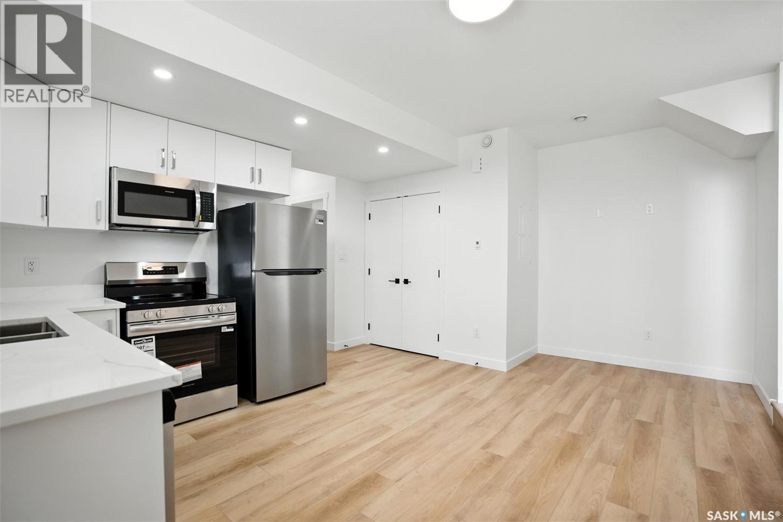138 Sharma Lane, Saskatoon, SK - Indoor Photo Showing Kitchen With Double Sink