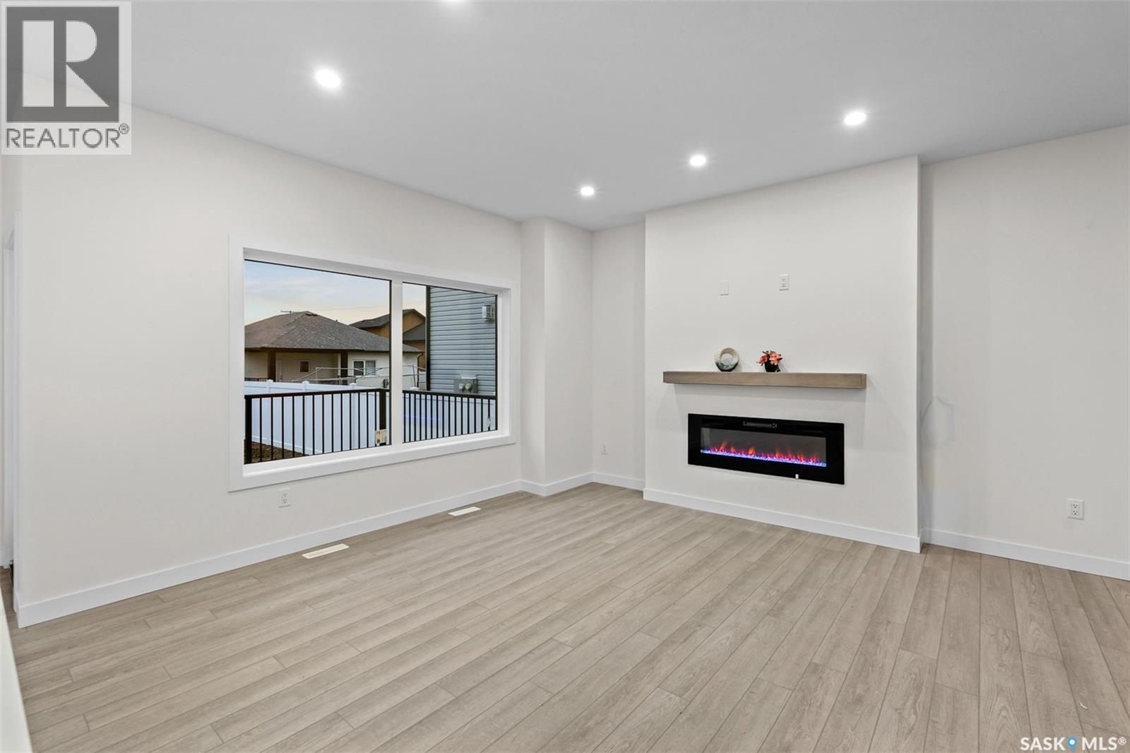 138 Sharma Lane, Saskatoon, SK - Indoor With Fireplace