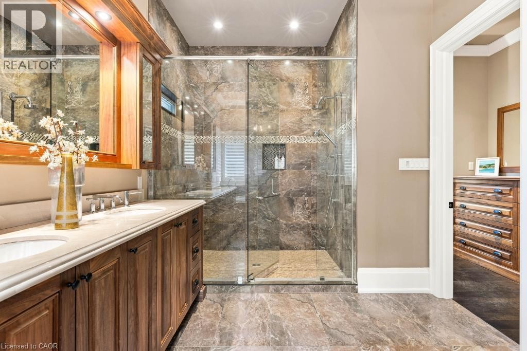 Dual vanity with under-mount sinks and wood cabinetry - 253 Rossmore Boulevard, Burlington, ON - Indoor Photo Showing Bathroom