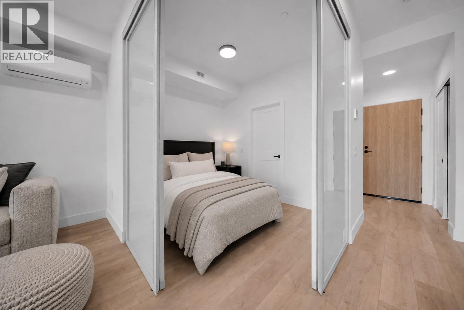 Photos have been virtually staged for illustrative and marketing purposes. Unaltered photos are also included for reference. - 620 Coronation Avenue Unit# 409, Kelowna, BC - Indoor Photo Showing Bedroom