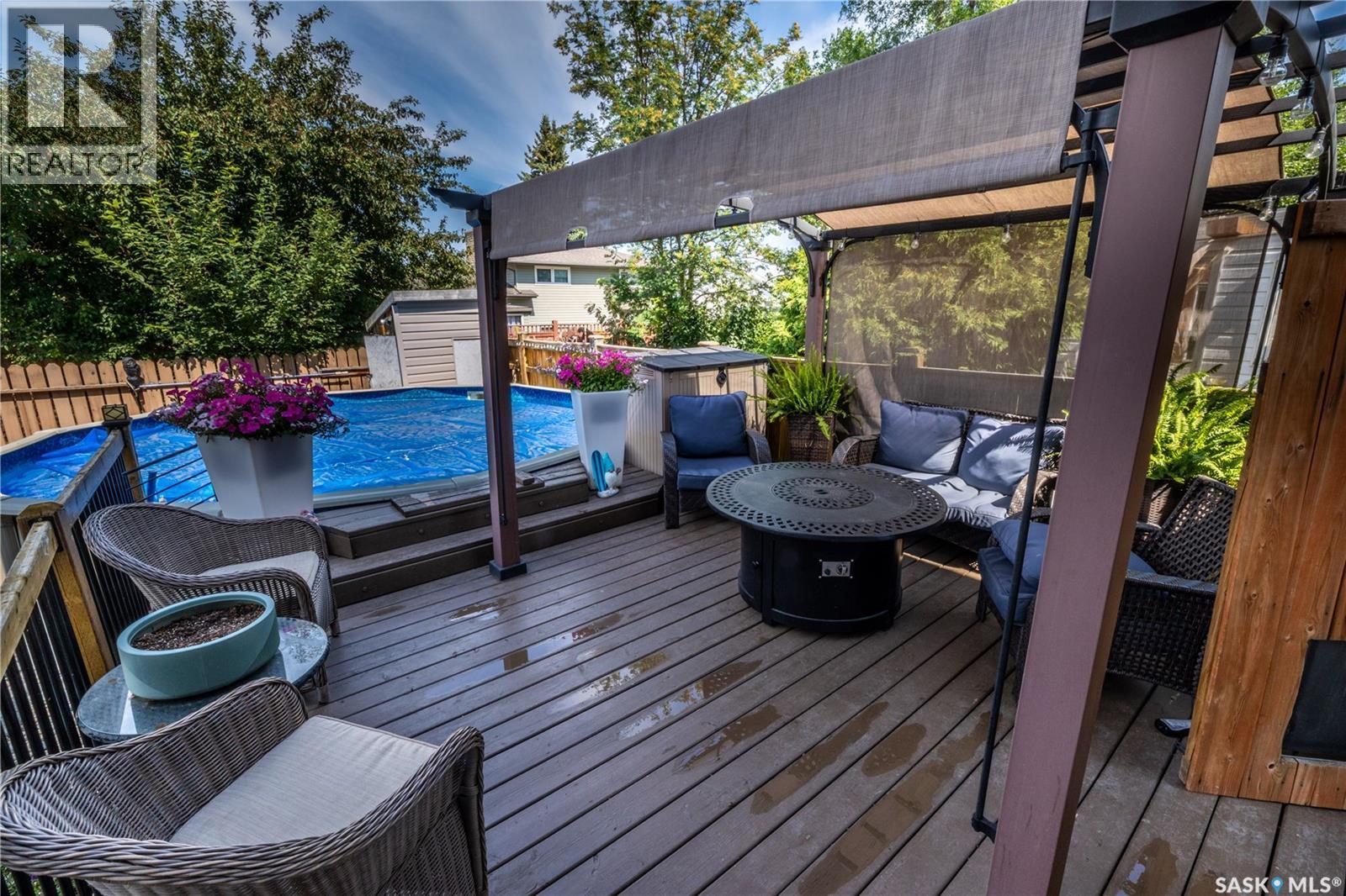 1259 Maybery Crescent, Moose Jaw, SK - Outdoor With Above Ground Pool With Deck Patio Veranda With Exterior