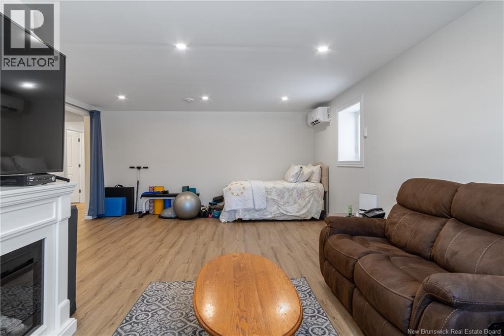 50 Walker Crescent, Hampton, NB - Indoor Photo Showing Other Room With Fireplace