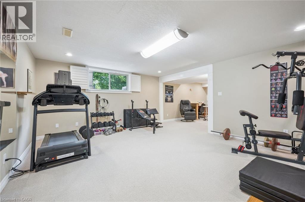 Expansive room with neutral carpet flooring and recessed lighting - 119 Sandy Ridge Place, Waterloo, ON - Indoor Photo Showing Gym Room