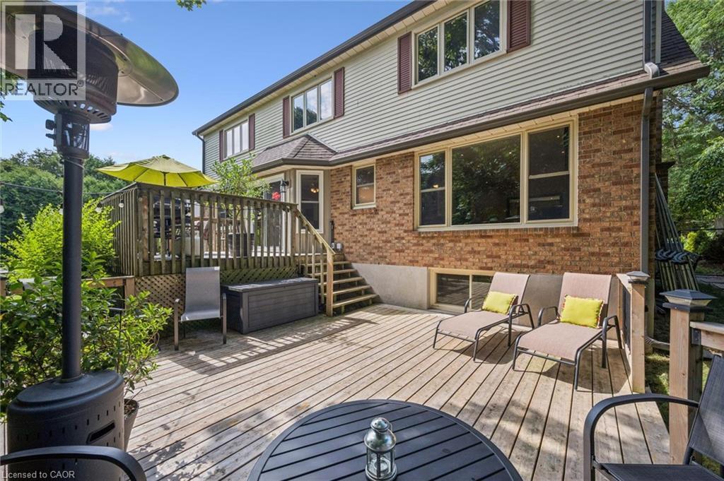 Multi-level outdoor deck with wood decking, brick exterior, and siding facade - 119 Sandy Ridge Place, Waterloo, ON - Outdoor With Deck Patio Veranda With Exterior