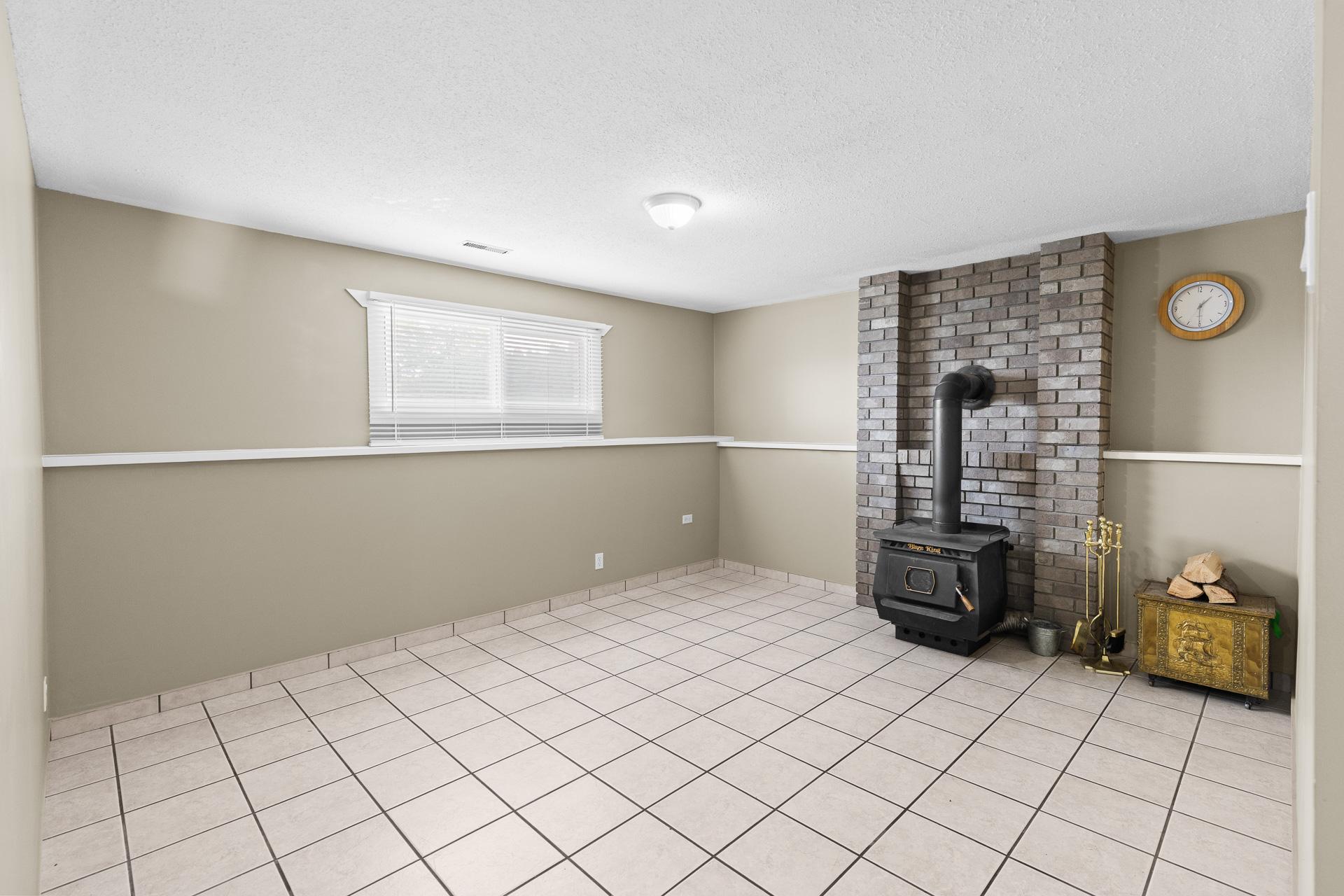 1643 Traut Court, Kelowna, BC - Indoor Photo Showing Other Room With Fireplace