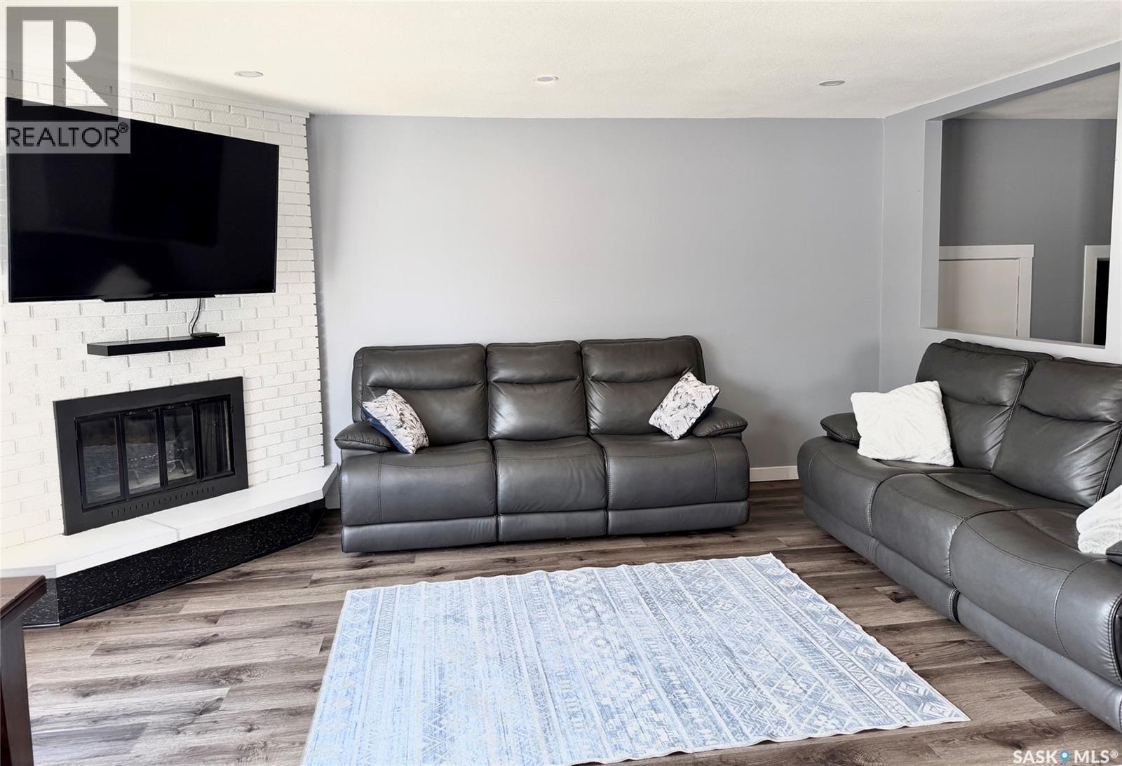 510 Redberry Road, Saskatoon, SK - Indoor Photo Showing Living Room With Fireplace