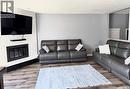 510 Redberry Road, Saskatoon, SK  - Indoor Photo Showing Living Room With Fireplace 