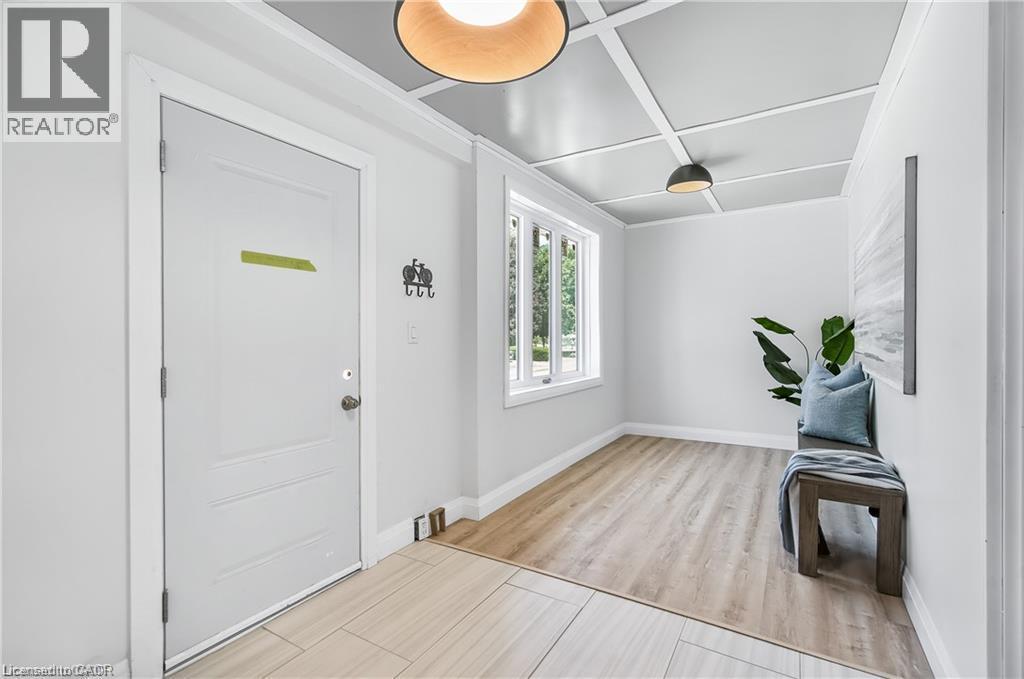 Entryway featuring a coffered ceiling with recessed lighting, large window, wood-finish flooring, and white interior walls - 10 Comet Avenue Unit# #1 (Main), Hamilton, ON - Indoor Photo Showing Other Room
