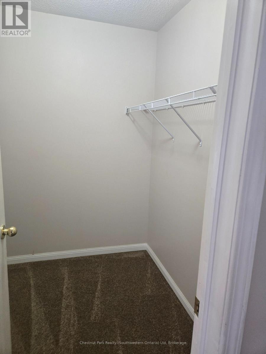 Primary bedroom walk-in closet - 147 Baggs Crescent, Cambridge, ON - Indoor With Storage