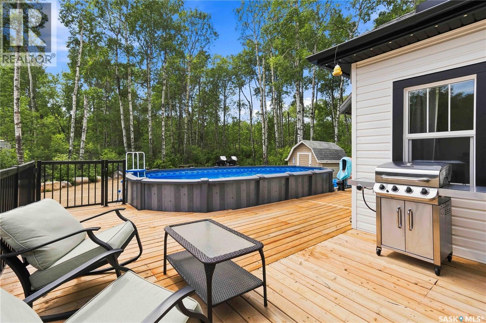 501 Coner Heights, Barrier Lake, SK - Outdoor With Above Ground Pool With Deck Patio Veranda With Exterior