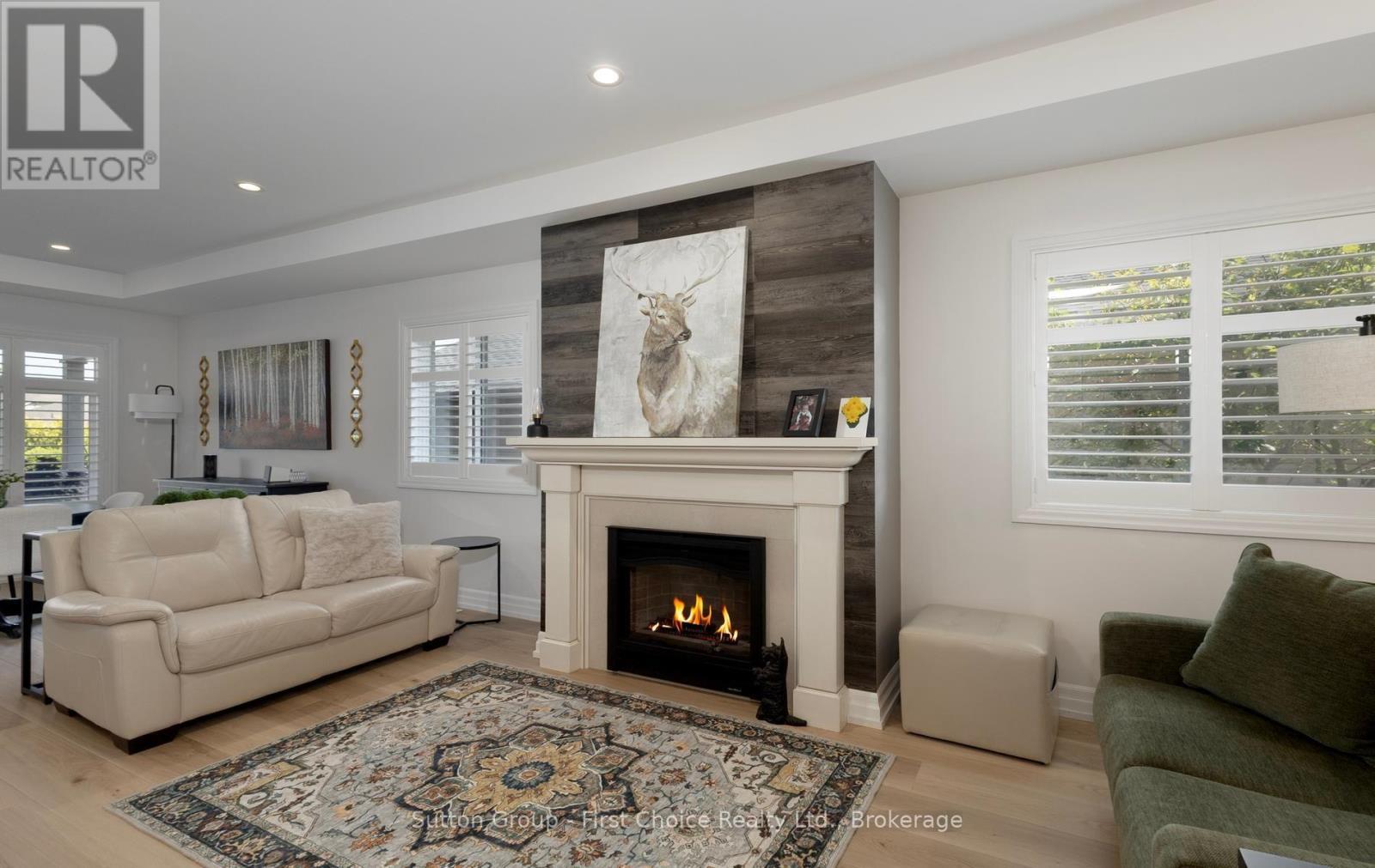 247 Sunset Drive, West Perth (Mitchell), ON - Indoor Photo Showing Living Room With Fireplace