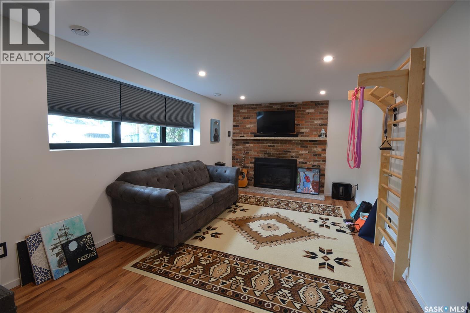 3335 Merritt Street, Saskatoon, SK - Indoor Photo Showing Living Room With Fireplace