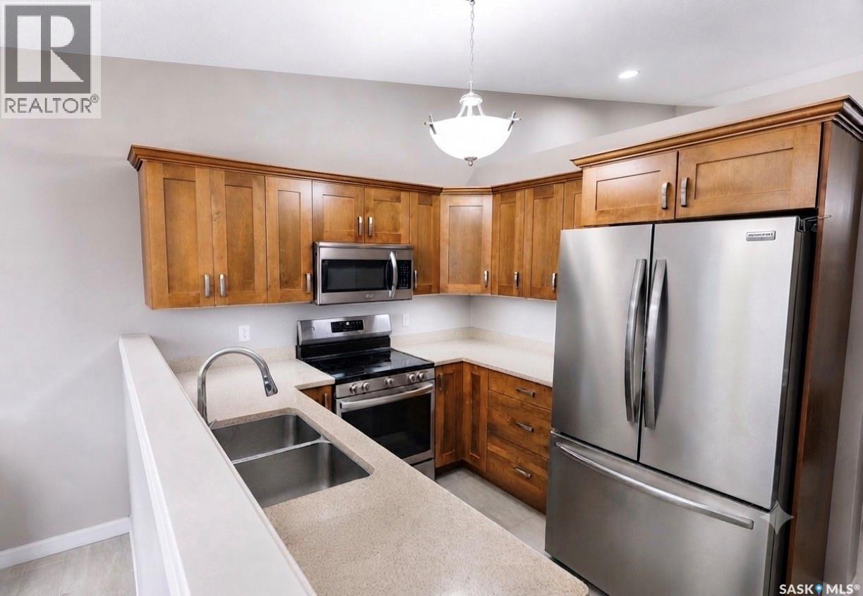 309 1851 Pederson Drive, Prince Albert, SK - Indoor Photo Showing Kitchen With Double Sink