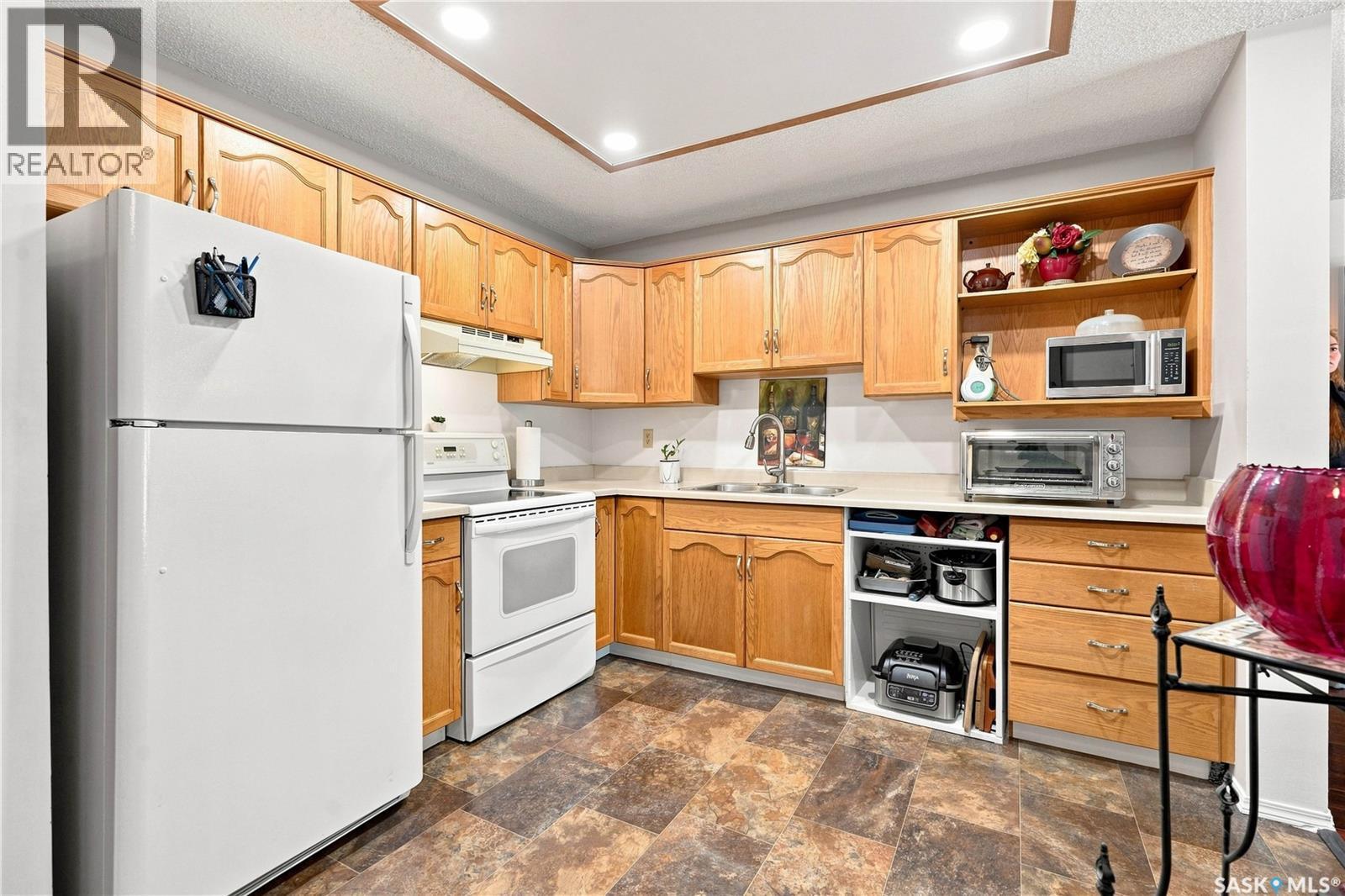 208 410 Main Street, Saskatoon, SK - Indoor Photo Showing Kitchen With Double Sink