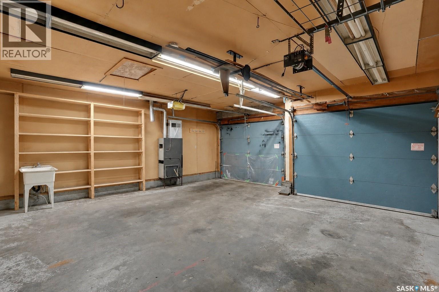 302 Doiron Road N, Regina, SK - Indoor Photo Showing Garage